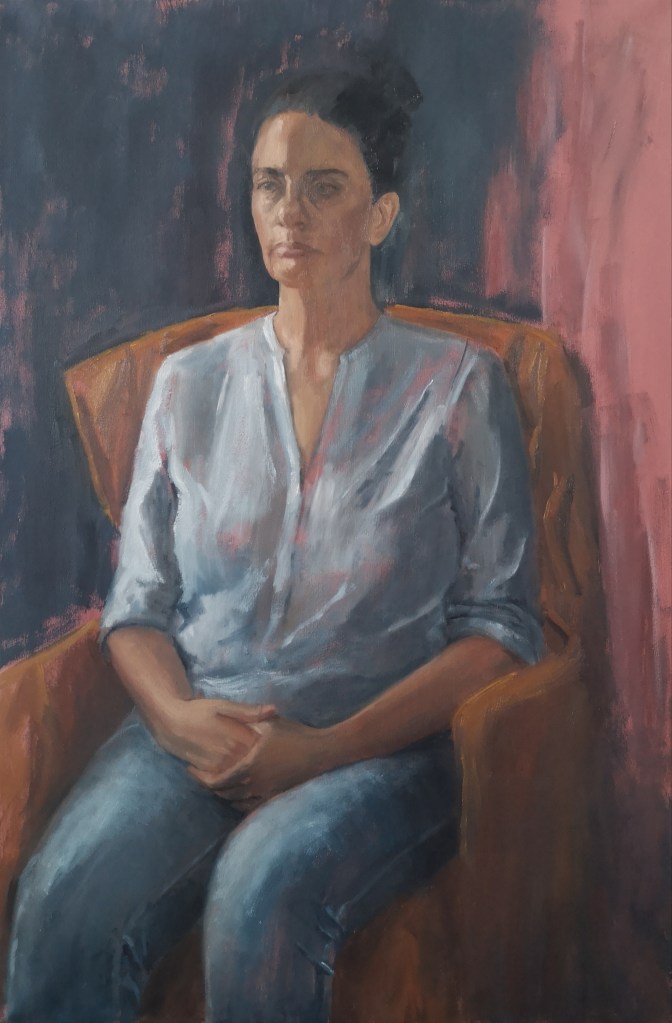 Portrait of Carla, seated woman on a yellow armchair, oil on canvas painted from life by Clara Niniewski
