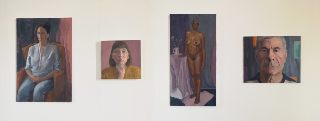 Panorama of exhibited oil portrait paintings by Clara Niniewski at Heatherley's School of Fine Art on Lots Road, Chelsea, London