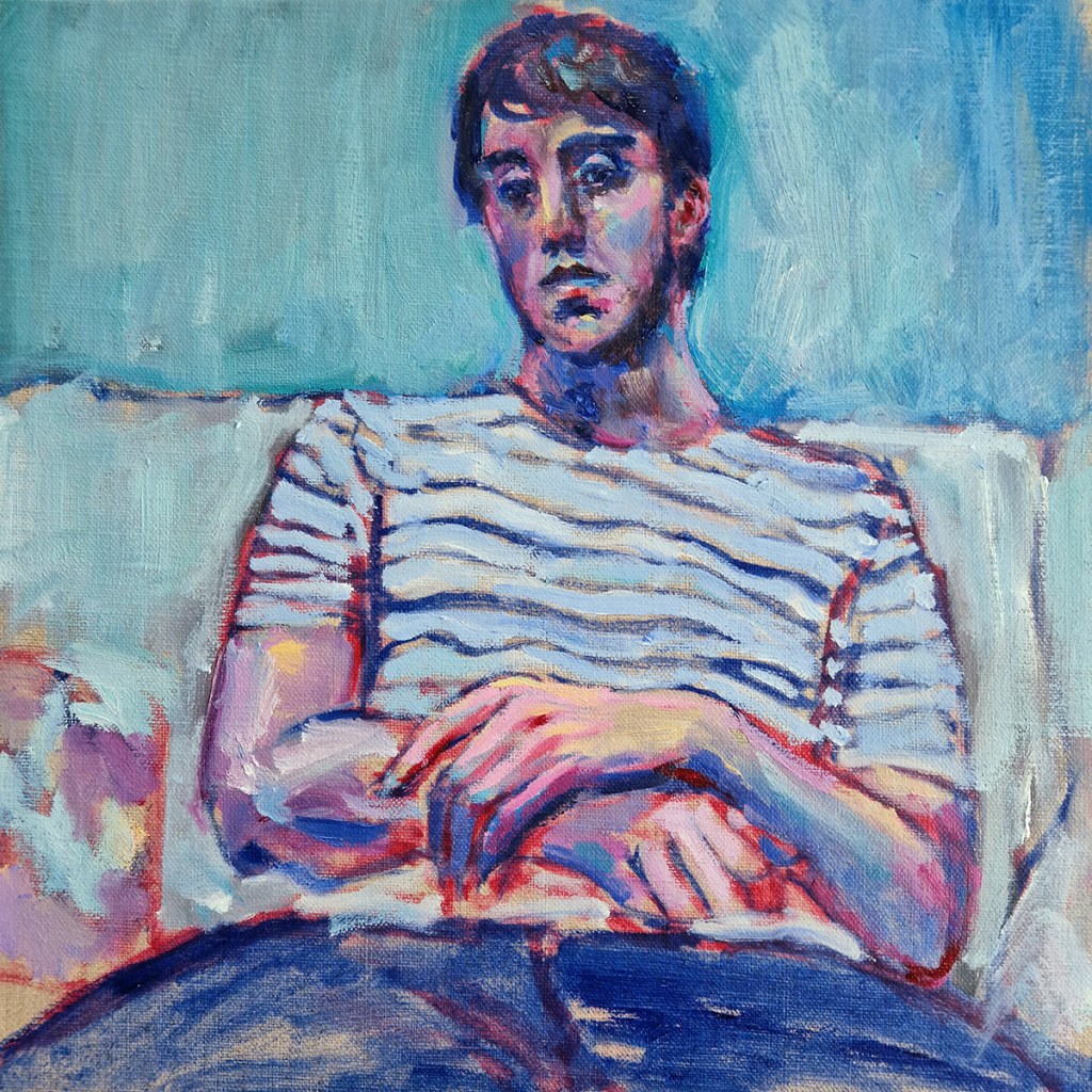 Leo, painted oil portrait by Clara Niniewski of a seated young man wearing a striped t-shirt, on a blue background. The vivid colours (blues and pinks) are in the continuity of Fauvism.